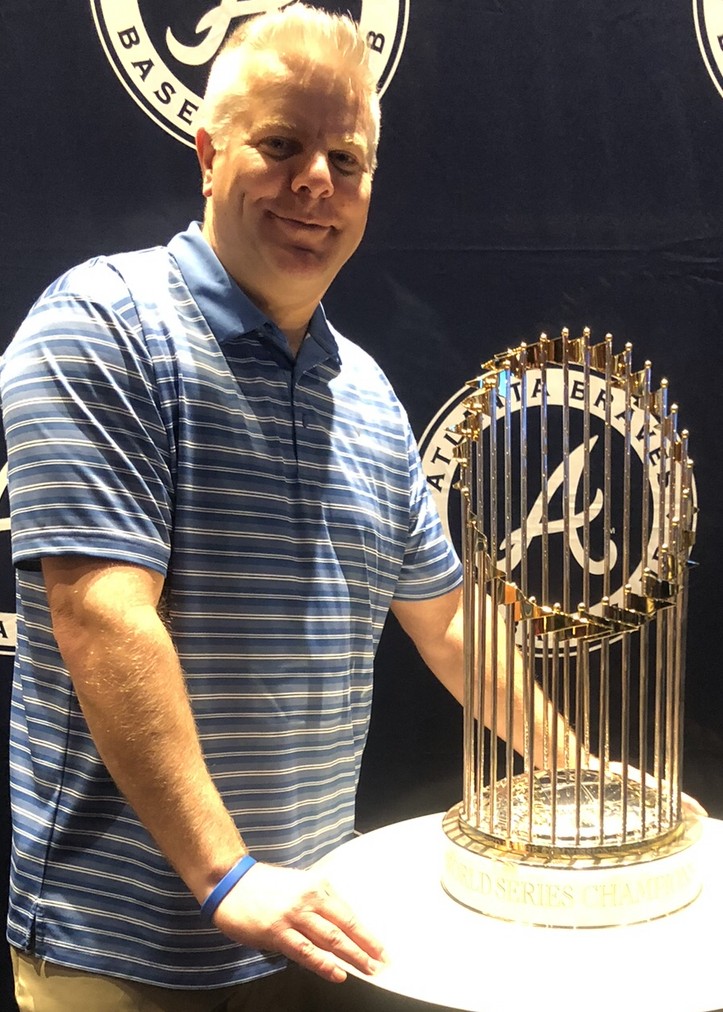 With World Series trophy (2)